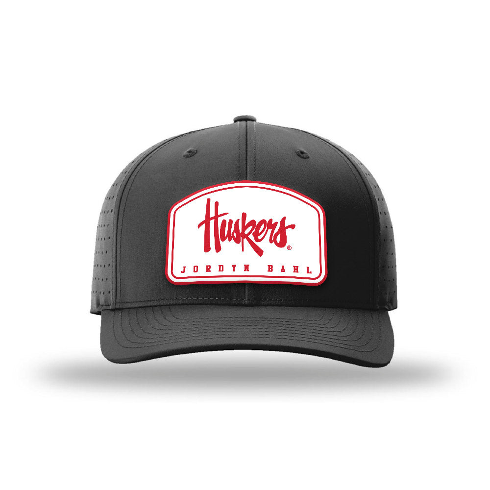 Nebraska - NCAA Softball : Jordyn Bahl - Suede Laser Performance Snapback Cap-0