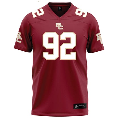 Boston College - NCAA Football : Caleb Jones - Maroon Football Jersey