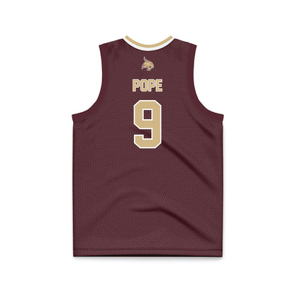 Texas State - NCAA Men's Basketball : Tylan Pope - Maroon Basketball Jersey