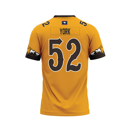 Wyoming - NCAA Football : Carson York - Gold Premium Football Jersey