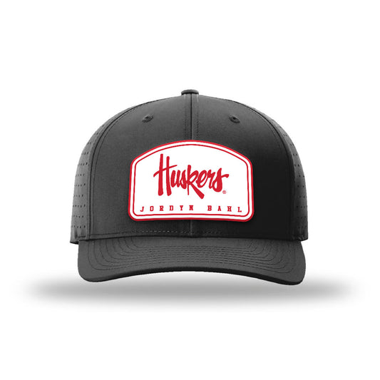 Nebraska - NCAA Softball : Jordyn Bahl - Suede Laser Performance Snapback Cap-0