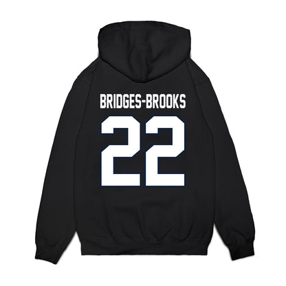 UConn - NCAA Football : Axavier Bridges-Brooks - Vintage Helmet Premium Hooded Sweatshirt-1
