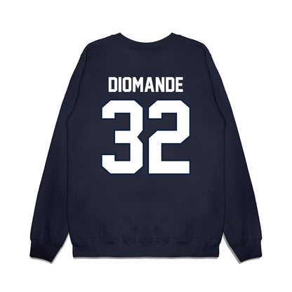 UConn - NCAA Football : oumar Diomande - Vintage Helmet Premium Crewneck Sweatshirt-1