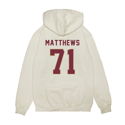FSU - NCAA Football : JaElyne Matthews - Vintage Helmet Premium Hooded Sweatshirt-1