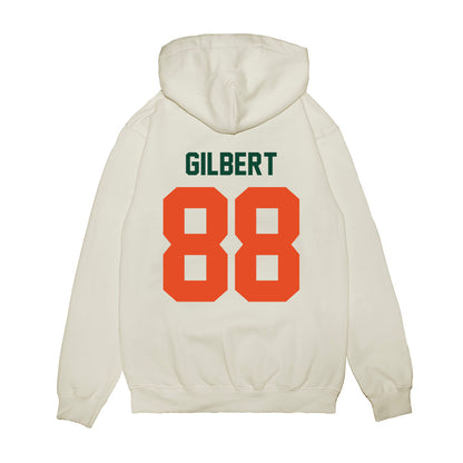 Miami - NCAA Football : Luka Gilbert - Vintage Helmet Premium Hooded Sweatshirt-1