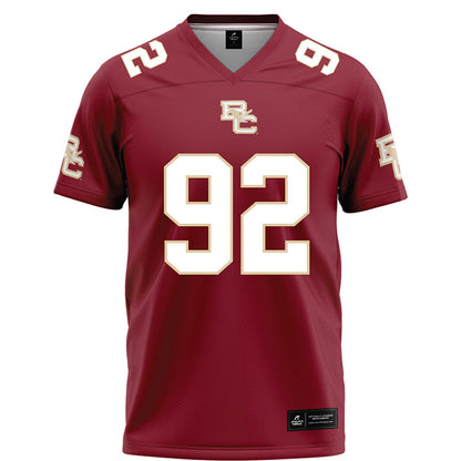 Boston College - NCAA Football : Caleb Jones - Maroon Football Jersey